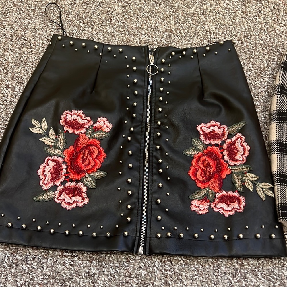 A cute trendy faux leather skirt! Worn twice. Comfy and flattering!